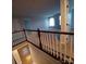 Upstairs hallway featuring plush carpeting, neutral colored walls, and access to multiple rooms at 3717 English Garden Dr, Gastonia, NC 28056