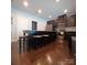 A well-appointed kitchen with dark wood cabinets, granite countertops, stainless steel appliances, and an island at 3717 English Garden Dr, Gastonia, NC 28056