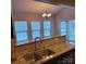 Kitchen sink and counter in open plan living space at 3717 English Garden Dr, Gastonia, NC 28056