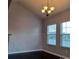 A cozy living room featuring hardwood floors, white walls, and natural light from two large windows at 3717 English Garden Dr, Gastonia, NC 28056