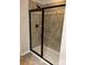 The bathroom features a modern tiled shower with a black-framed glass door at 3717 English Garden Dr, Gastonia, NC 28056
