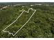 The property, defined by a boundary line, showcases a mix of dense woodland and natural beauty at 3881 Wood Duck Ln, Denver, NC 28037