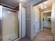 Bathroom with a walk-in shower and view to other rooms for practical living at 3881 Wood Duck Ln, Denver, NC 28037