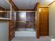 Shower with sliding doors, grab bar, and vanity with medicine cabinet providing safety and storage at 3881 Wood Duck Ln, Denver, NC 28037