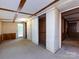 Bedroom with closet, door to the exterior and view to other rooms offer space and functionality at 3881 Wood Duck Ln, Denver, NC 28037