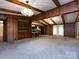 Open-concept dining room with beamed ceilings connecting to living areas at 3881 Wood Duck Ln, Denver, NC 28037