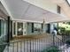 Inviting covered front porch with wood floors and decorative railing at 3881 Wood Duck Ln, Denver, NC 28037