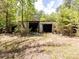 This is an old garage with a lot of potential that can be turned into a work shop or additional storage at 3881 Wood Duck Ln, Denver, NC 28037