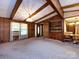 Bright living room featuring beamed ceilings and a built-in cabinet at 3881 Wood Duck Ln, Denver, NC 28037