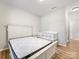 Clean bedroom with white furniture, including a queen bed and a crib, offering a comfortable and versatile space at 4014 Stockbrook Dr, Charlotte, NC 28215