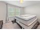 Cozy bedroom with a comfortable mattress, complemented by natural light streaming through the window at 4014 Stockbrook Dr, Charlotte, NC 28215