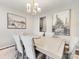 Beautiful dining room featuring modern table set and chandelier at 4014 Stockbrook Dr, Charlotte, NC 28215