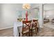 Charming dining room with a view, featuring a modern chandelier and open layout at 4014 Stockbrook Dr, Charlotte, NC 28215