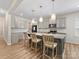 Open-concept kitchen with a granite island, pendant lighting, and modern stainless steel appliances at 4014 Stockbrook Dr, Charlotte, NC 28215