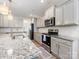 Well-appointed kitchen boasts granite countertops, stainless steel appliances, and a functional design at 4014 Stockbrook Dr, Charlotte, NC 28215
