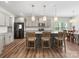 Bright kitchen features a large center island, stainless appliances, and open flow to the dining area at 4014 Stockbrook Dr, Charlotte, NC 28215
