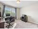 Bright office featuring desk, neutral walls, and natural light from the window at 4014 Stockbrook Dr, Charlotte, NC 28215