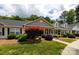 Charming home featuring a well-manicured lawn, mature landscaping, and welcoming curb appeal at 409 Guiness Pl, Rock Hill, SC 29730
