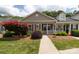 Inviting home exterior featuring manicured landscaping and a charming covered porch at 409 Guiness Pl, Rock Hill, SC 29730