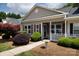 Inviting home exterior featuring manicured landscaping and a charming covered porch at 409 Guiness Pl, Rock Hill, SC 29730