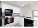 Efficient kitchen with white cabinetry and modern appliances at 409 Guiness Pl, Rock Hill, SC 29730