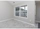 Bright living room with a large window and tile flooring at 409 Guiness Pl, Rock Hill, SC 29730