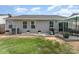 Backyard featuring a patio area, lawn, barbecue grill and tidy landscaping near the house at 4227 Mackinnon Dr, Charlotte, NC 28214