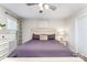 Comfortable bedroom with a ceiling fan, a bright window, and a large bed with a purple duvet at 4227 Mackinnon Dr, Charlotte, NC 28214
