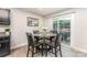Cozy dining nook with a glass-topped table, perfect for intimate meals at 4227 Mackinnon Dr, Charlotte, NC 28214