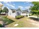 A shot of the side of two light gray single-story houses with well-kept lawns at 4227 Mackinnon Dr, Charlotte, NC 28214