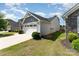 A lovely single-story home with a two-car garage, adjacent to a well-maintained lawn at 4227 Mackinnon Dr, Charlotte, NC 28214