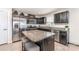 Modern kitchen with a granite-topped island, stainless appliances, and dark cabinetry at 4227 Mackinnon Dr, Charlotte, NC 28214