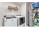Well-equipped laundry room with a washer, a dryer, shelves, and a water heater at 4227 Mackinnon Dr, Charlotte, NC 28214