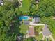 An elevated shot of a property including the pool, backyard, and surrounding community at 4911 Rivergreen Ln, Charlotte, NC 28227