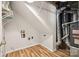 Unfinished basement area with sloped ceiling, furnace, and shelving at 4911 Rivergreen Ln, Charlotte, NC 28227