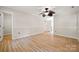 Spacious bedroom with ceiling fan, hardwood floors and white trim at 4911 Rivergreen Ln, Charlotte, NC 28227