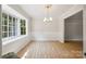 Airy dining room featuring a large bay window with backyard view at 4911 Rivergreen Ln, Charlotte, NC 28227