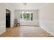 Bright dining room with large bay window and modern chandelier at 4911 Rivergreen Ln, Charlotte, NC 28227