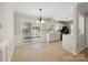 Charming kitchen and dining area with updated appliances and access to outdoor screened porch at 4911 Rivergreen Ln, Charlotte, NC 28227