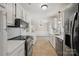 Modern kitchen with stainless steel appliances, quartz countertops and ample storage at 4911 Rivergreen Ln, Charlotte, NC 28227
