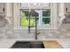 Kitchen sink with gooseneck faucet and tiled backsplash at 4911 Rivergreen Ln, Charlotte, NC 28227