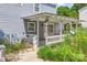 Covered patio with a partial view of the backyard at 4911 Rivergreen Ln, Charlotte, NC 28227