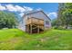 Backyard with a new deck, green grass, and new construction at 5185 Grand Canyon Rd, Concord, NC 28027