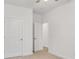 A simple bedroom with carpeted floor and a ceiling fan with lights at 5185 Grand Canyon Rd, Concord, NC 28027