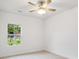A simple bedroom with carpeted floor and a ceiling fan with lights at 5185 Grand Canyon Rd, Concord, NC 28027