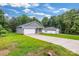 Exterior showcases the house and detached garage with a long driveway at 5185 Grand Canyon Rd, Concord, NC 28027