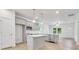 Well-lit kitchen featuring gray cabinets, an island, and stainless steel appliances at 5185 Grand Canyon Rd, Concord, NC 28027
