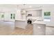 Modern kitchen featuring stainless steel appliances, a subway tile backsplash, and an island at 5185 Grand Canyon Rd, Concord, NC 28027