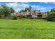 Townhomes feature backyard lawn space with wooden decks and staircases at 5192 Corbin Ln, Hickory, NC 28601