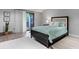 Cozy bedroom features a bed with floral bedding, soft rug, and sliding door to balcony at 5192 Corbin Ln, Hickory, NC 28601